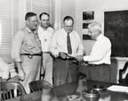 Presentation of capital awards to three employees for 1950