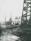 Workers in the Goose Creek Oil Field, covered in oil